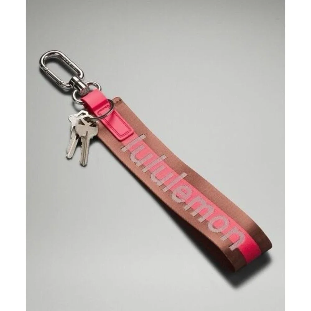 Lululemon Never Lost Keychain Wordmark Brown Pink One Size NWT